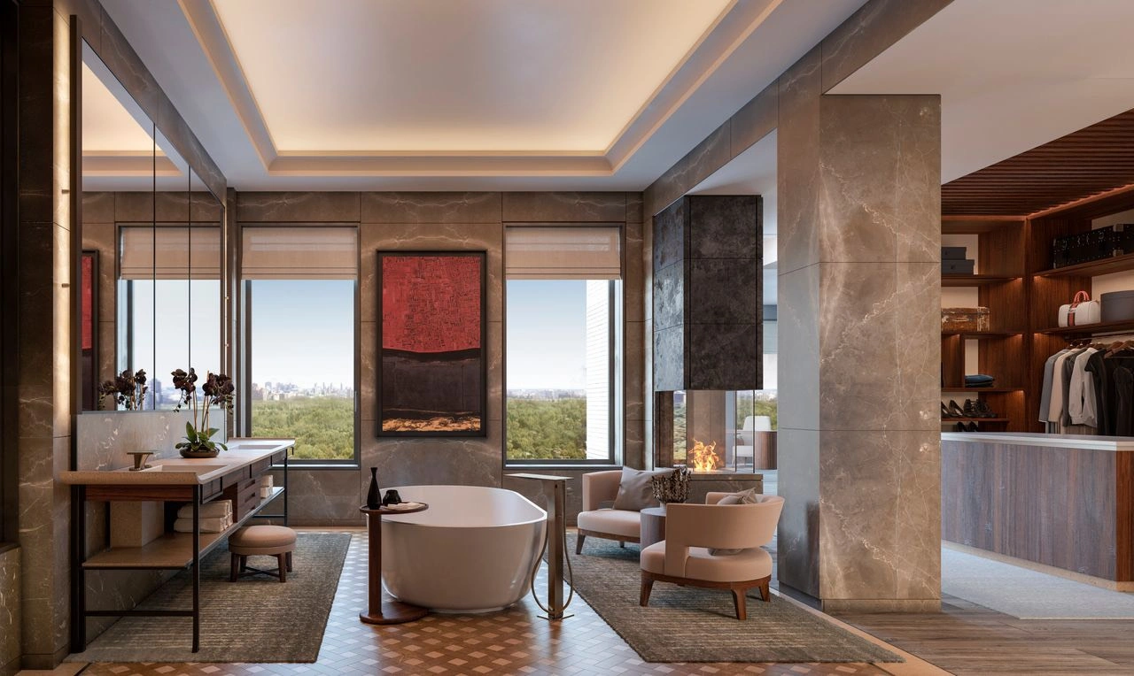 The apartment's master suite features two walk-in closets, a bathroom with a soaking tub, shower, and heated floors. Beyond the master bedroom is a private terrace with a jacuzzi. Photo: Douglas Elliman.